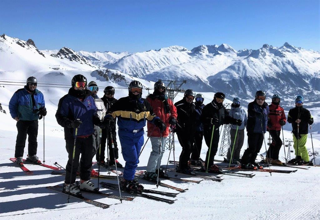 Enzian Ski Club members skiing alpine mountains